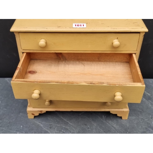 1011 - An old miniature painted pine chest of drawers, 31.5cm high x 32cm wide.