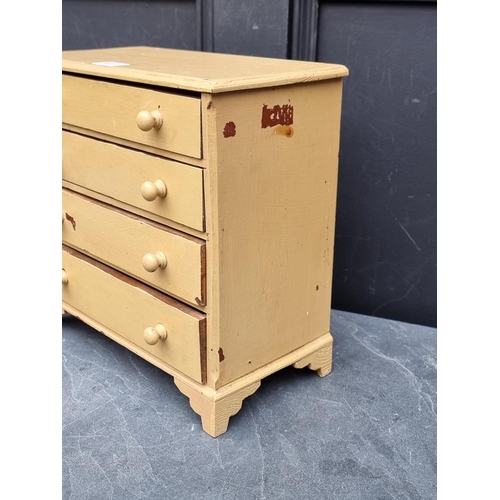 1011 - An old miniature painted pine chest of drawers, 31.5cm high x 32cm wide.