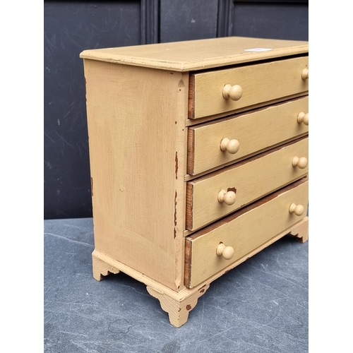 1011 - An old miniature painted pine chest of drawers, 31.5cm high x 32cm wide.