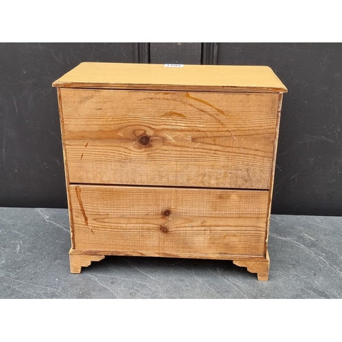 1011 - An old miniature painted pine chest of drawers, 31.5cm high x 32cm wide.