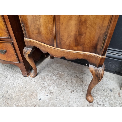 1016 - A small walnut bowfront chest of drawers, 45cm wide; together with another small walnut side ca... 