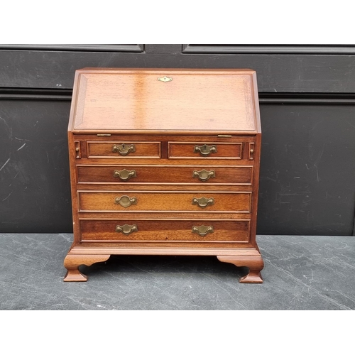 1017 - A miniature reproduction mahogany bureau, 45.5cm high x 41cm wide.