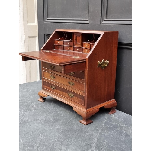 1017 - A miniature reproduction mahogany bureau, 45.5cm high x 41cm wide.