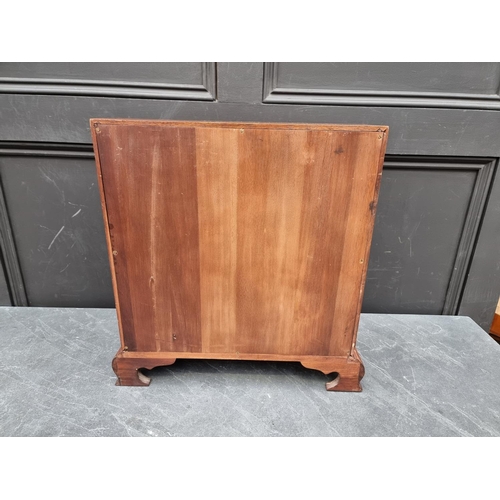 1017 - A miniature reproduction mahogany bureau, 45.5cm high x 41cm wide.