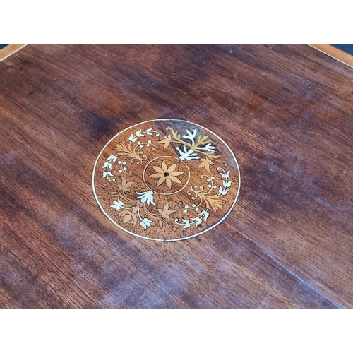 1019 - An Edwardian mahogany and inlaid revolving bookcase, 46.5cm wide, (faults).