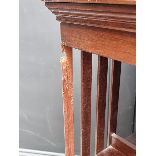 1019 - An Edwardian mahogany and inlaid revolving bookcase, 46.5cm wide, (faults).