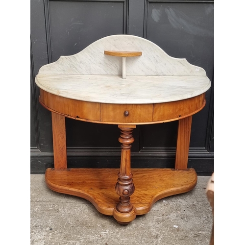 1021 - A Victorian satin birch and marble top washstand, 106.5cm wide.