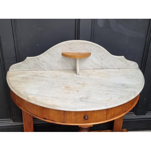 1021 - A Victorian satin birch and marble top washstand, 106.5cm wide.