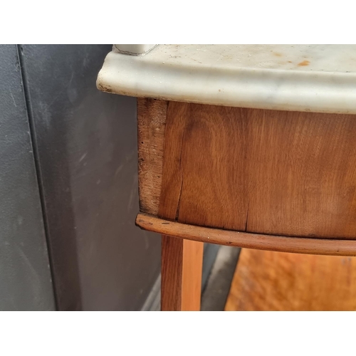 1021 - A Victorian satin birch and marble top washstand, 106.5cm wide.