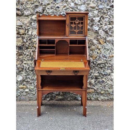 1024 - An Arts & Crafts walnut bureau, in the manner of Shapland & Petter, with lateral drop l... 