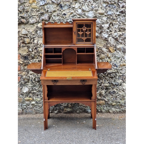 1024 - An Arts & Crafts walnut bureau, in the manner of Shapland & Petter, with lateral drop l... 