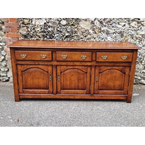 1026 - A good reproduction oak dresser base, possibly Titchmarsh & Goodwin, 167.5cm wide.... 