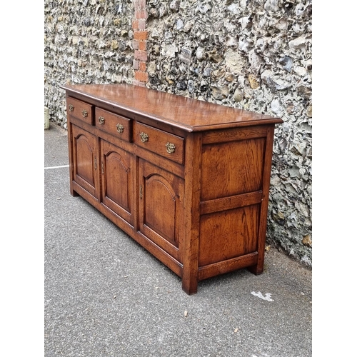 1026 - A good reproduction oak dresser base, possibly Titchmarsh & Goodwin, 167.5cm wide.... 