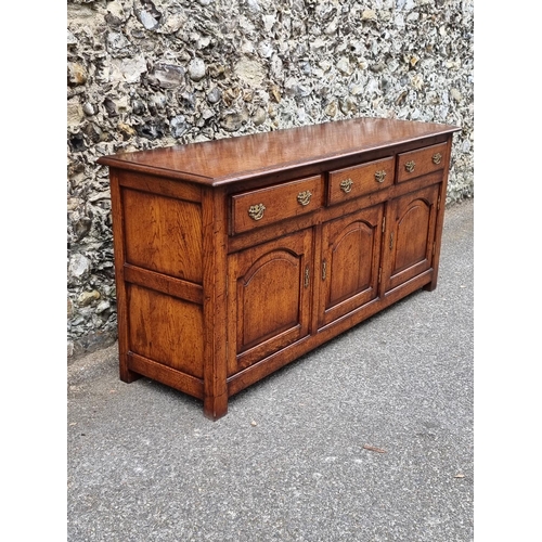 1026 - A good reproduction oak dresser base, possibly Titchmarsh & Goodwin, 167.5cm wide.... 