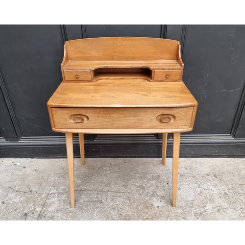 1028 - A mid-century Ercol elm and beech 439/479 writing desk, with blue sticker, 68.5cm wide.... 