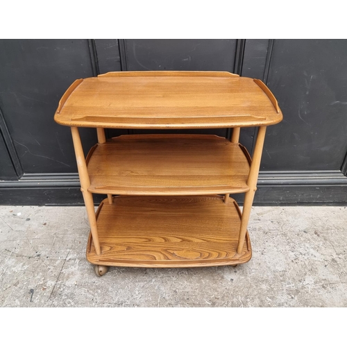 1029 - A mid-century Ercol elm and beech 458 trolley, with blue sticker, 71cm wide.