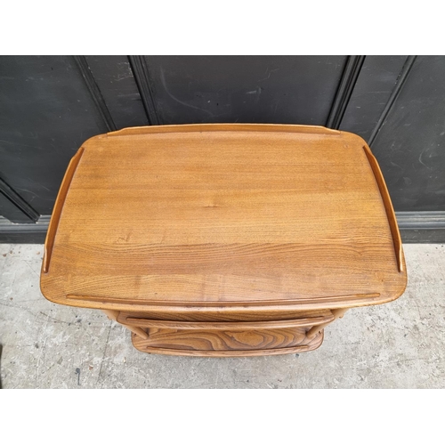 1029 - A mid-century Ercol elm and beech 458 trolley, with blue sticker, 71cm wide.