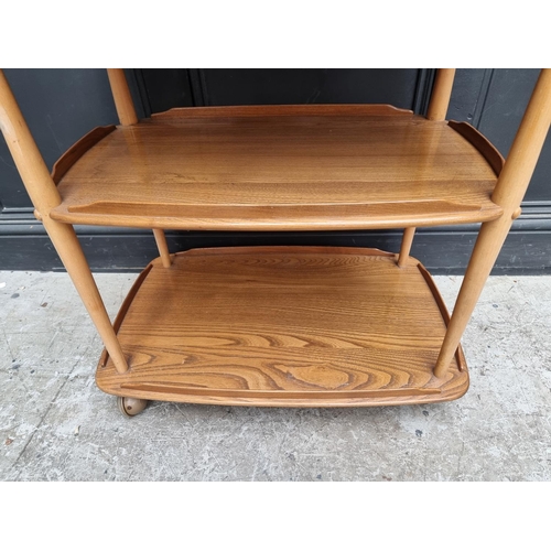 1029 - A mid-century Ercol elm and beech 458 trolley, with blue sticker, 71cm wide.