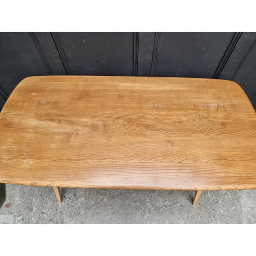 1031 - A mid-century Ercol elm and beech 382 Windsor dining table, 152cm long.