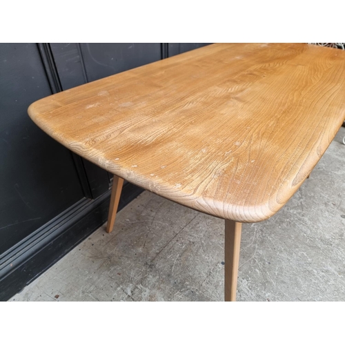 1031 - A mid-century Ercol elm and beech 382 Windsor dining table, 152cm long.