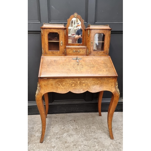 1037 - A Louis XV style walnut and inlaid bonheur du jour, with gilt brass mounts, 81cm wide.... 