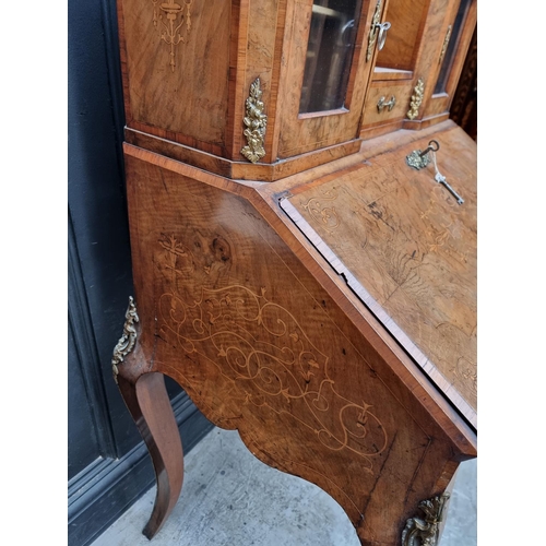 1037 - A Louis XV style walnut and inlaid bonheur du jour, with gilt brass mounts, 81cm wide.... 