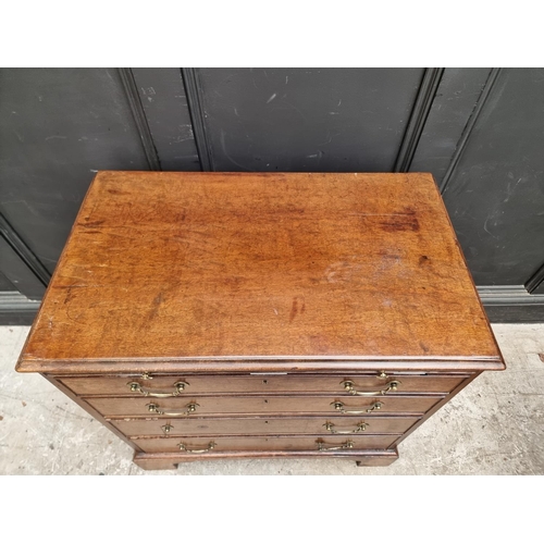 1045 - A small George III mahogany chest of drawers, with brushing slide, 76cm wide.