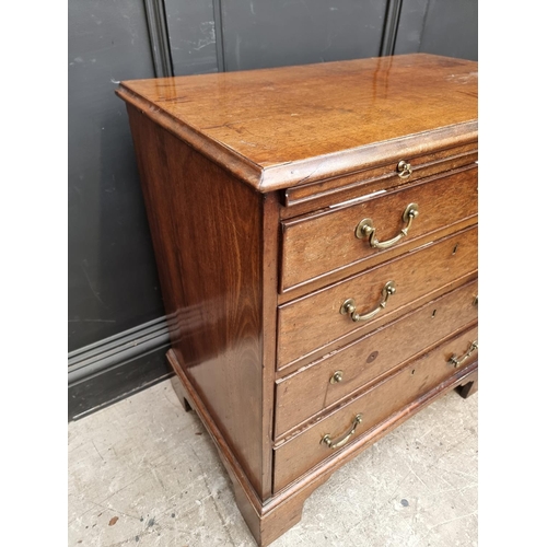 1045 - A small George III mahogany chest of drawers, with brushing slide, 76cm wide.