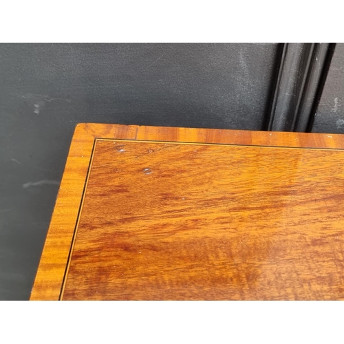 1047 - A late Victorian mahogany and line inlaid bowfront sideboard, 137cm wide.