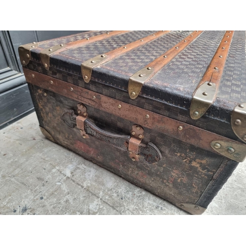 1048 - A late 19th/early 20th century Moynat 'Damier' trunk, labelled to the interior, 34cm high x 110.5cm ... 