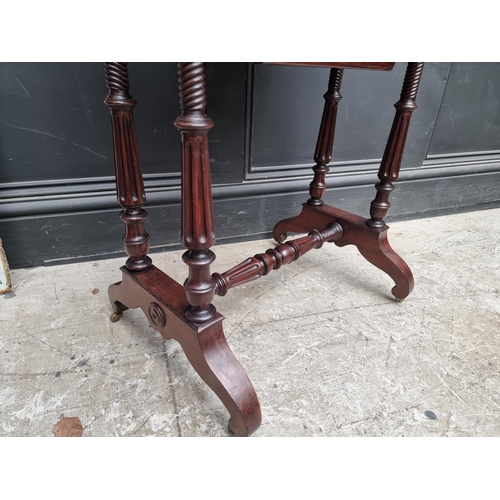 1052 - A 19th century continental mahogany work table, with hinged top, 55cm wide.