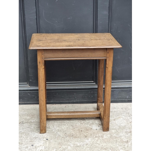 1054 - A small 18th century oak centre table, with chamfered legs, 63cm wide.