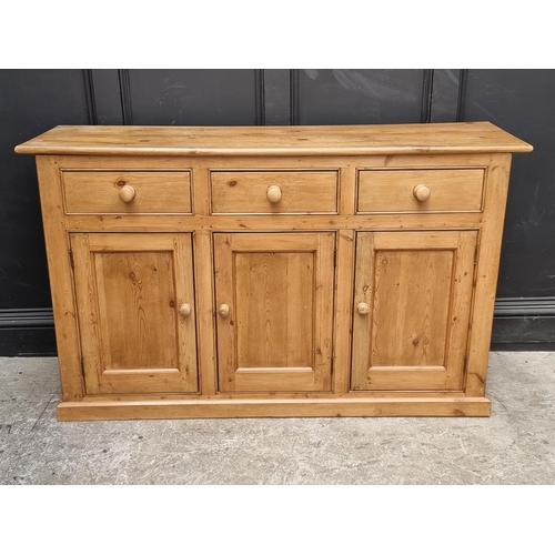 1055 - An old pine side cabinet, 152.5cm wide.