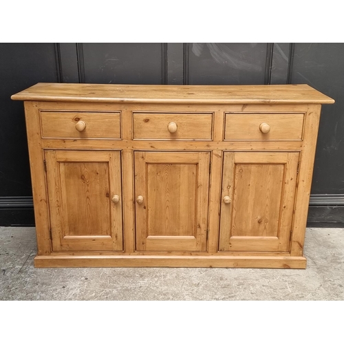 1055 - An old pine side cabinet, 152.5cm wide.