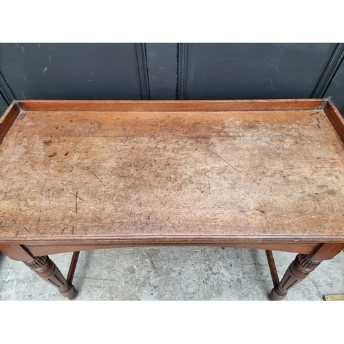 1057 - A late Victorian mahogany serving table, 106.5cm wide.