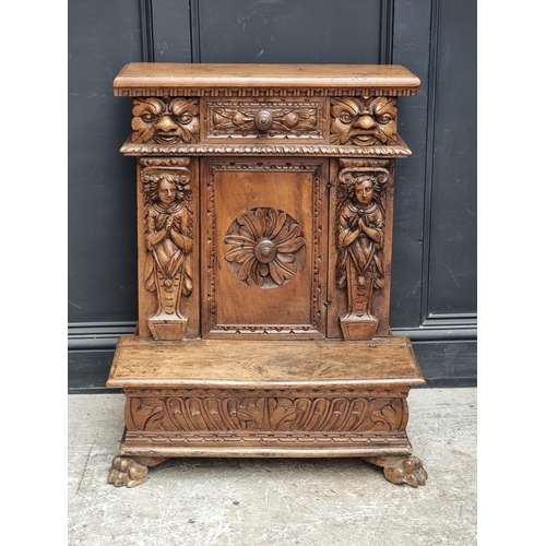 1061 - A 17th century and later Italian carved walnut prie dieu, 71cm wide.