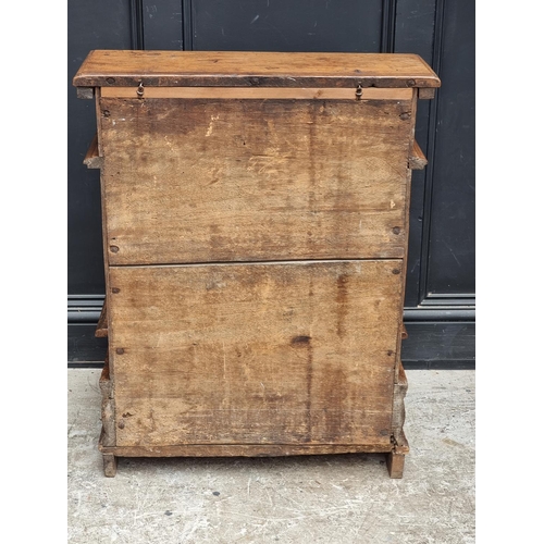 1061 - A 17th century and later Italian carved walnut prie dieu, 71cm wide.