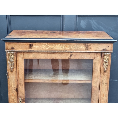 1062 - A late Victorian walnut and inlaid pier cabinet, 81.5cm wide.