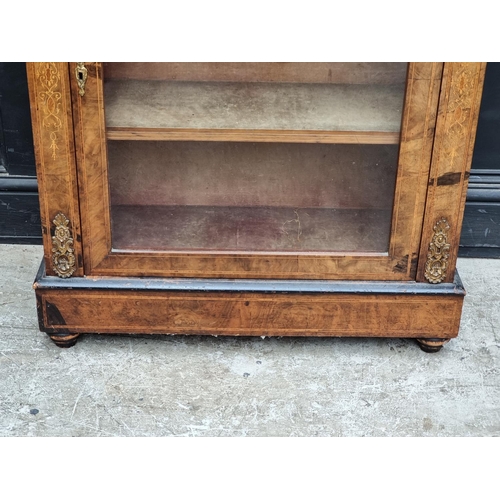 1062 - A late Victorian walnut and inlaid pier cabinet, 81.5cm wide.