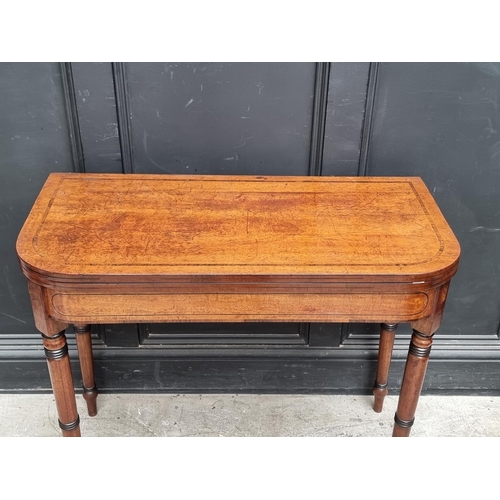 1066 - A George IV mahogany, line inlaid and crossbanded card table, with double gateleg, 91cm wide.... 