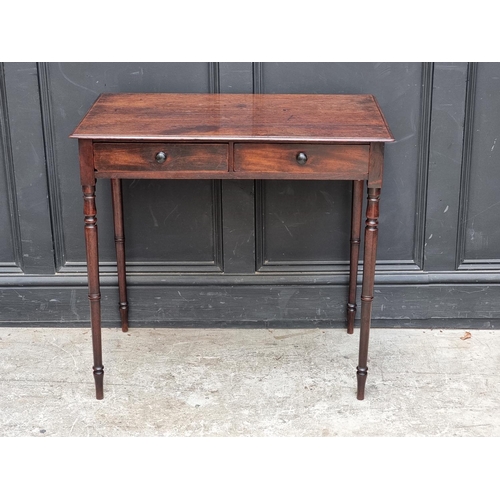 1068 - A circa 1800 mahogany two drawer side table, 76.5cm wide.