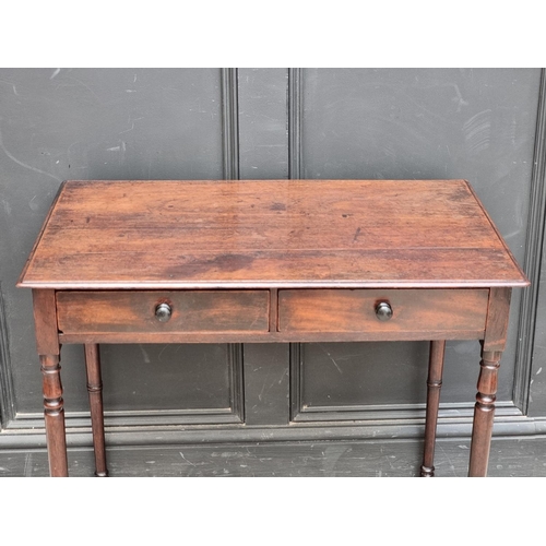 1068 - A circa 1800 mahogany two drawer side table, 76.5cm wide.