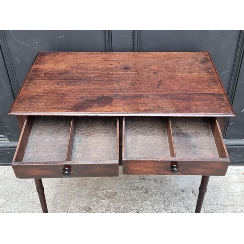 1068 - A circa 1800 mahogany two drawer side table, 76.5cm wide.