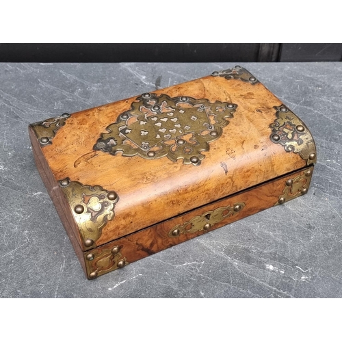 1070 - A late 19th century figured walnut and gilt brass games box, with void interior, 27cm wide.... 