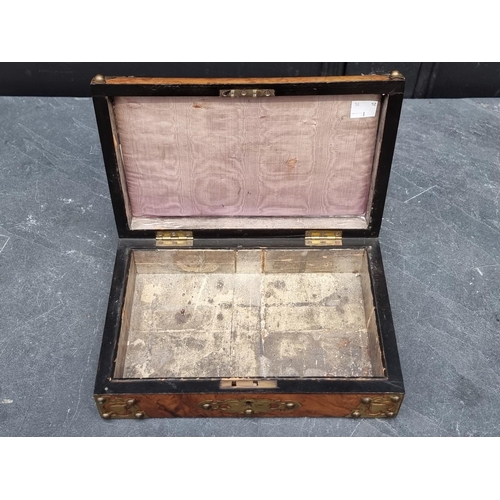 1070 - A late 19th century figured walnut and gilt brass games box, with void interior, 27cm wide.... 