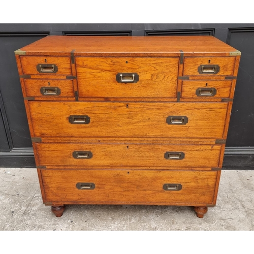 1074 - An early 20th century teak and brass bound campaign chest, with inset ivory label inscribed 'Army &a... 