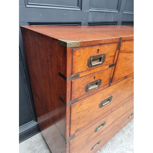 1074 - An early 20th century teak and brass bound campaign chest, with inset ivory label inscribed 'Army &a... 