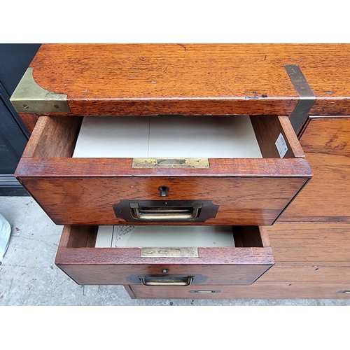 1074 - An early 20th century teak and brass bound campaign chest, with inset ivory label inscribed 'Army &a... 