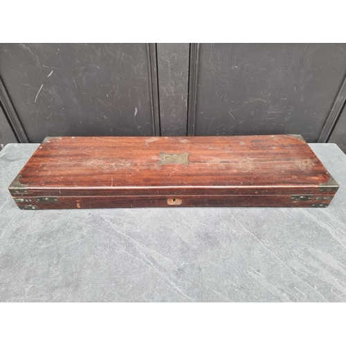 1075 - A Victorian mahogany and brass bound shotgun case, 83cm wide, (crack to top).