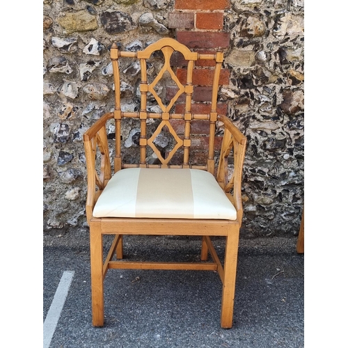 1080 - An unusual set of ten carved beech dining chairs, to include a pair of elbow chairs, in the Chinese ... 